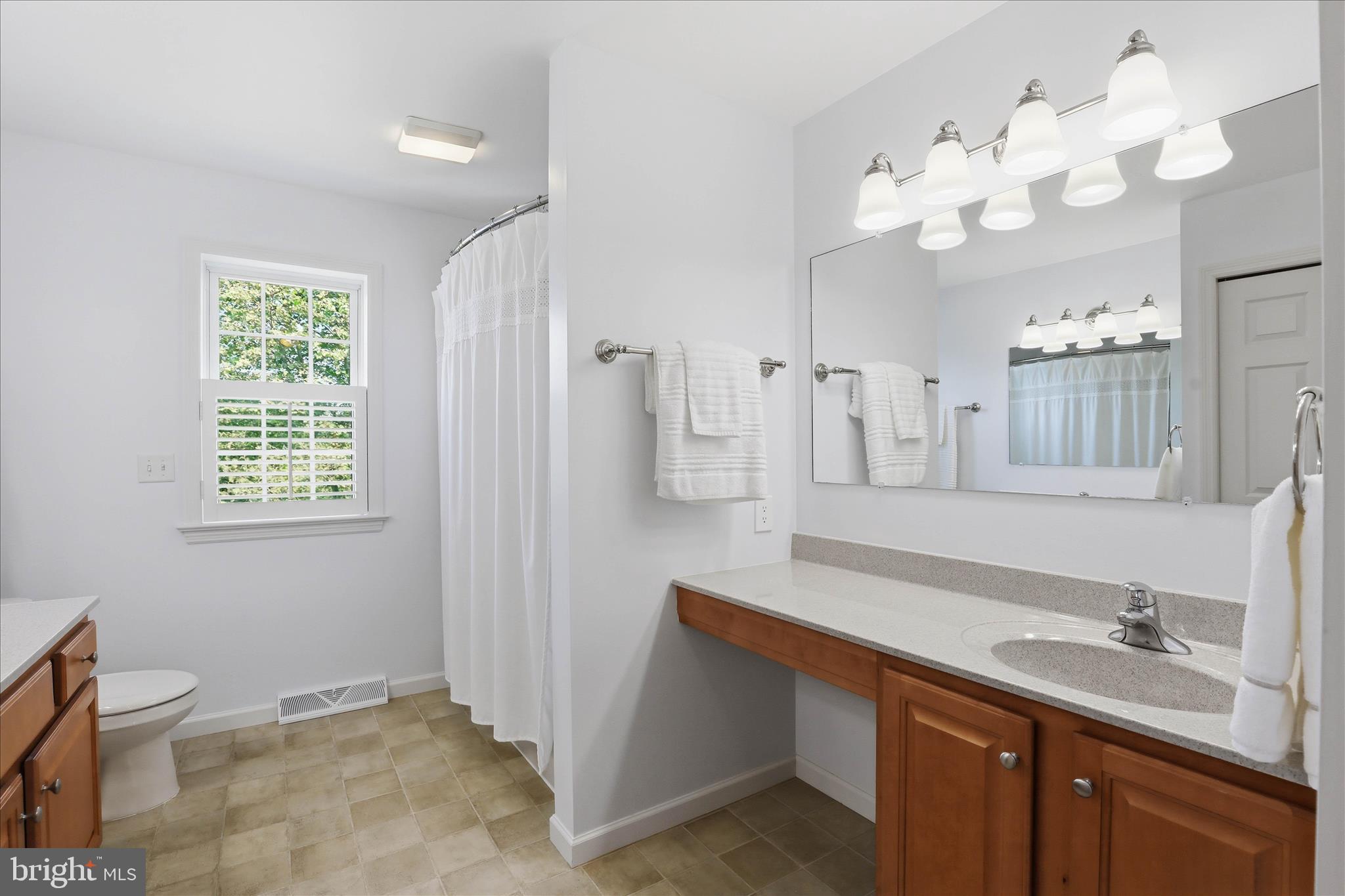 533 Thornberry Lane Lititz, PA 17543 - Photo 29 of 56 a spacious bathroom with a granite countertop sink a toilet and a mirror