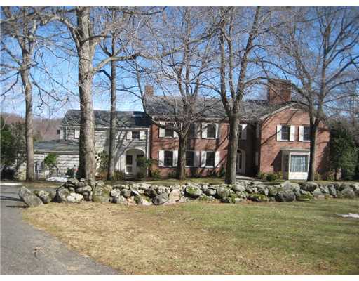 807 Smith Ridge Road New Canaan, CT 06840 - Photo 1 of 10 a front view of house with yard