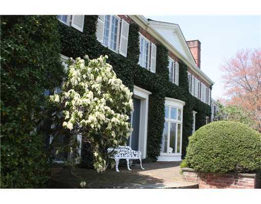 807 Smith Ridge Road New Canaan, CT 06840 - Photo 6 of 10 a front view of a house with a yard