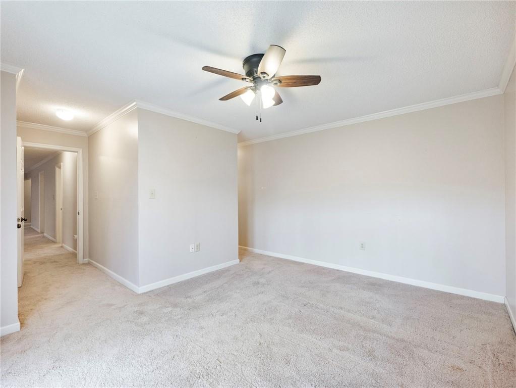 2235 Old Hamilton Place, Unit 100B Gainesville, GA 30507 - Photo 15 of 31 an empty room with closet and a chandelier fan
