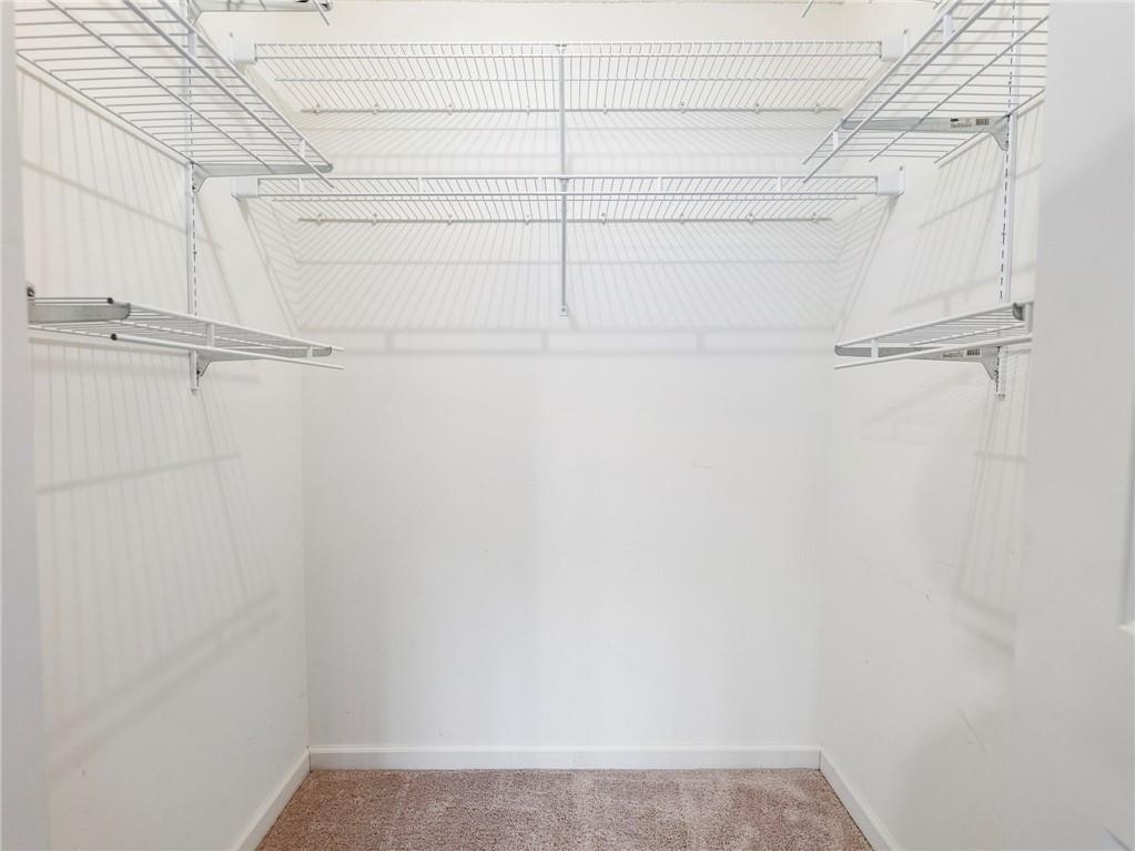 2235 Old Hamilton Place, Unit 100B Gainesville, GA 30507 - Photo 24 of 31 a view of a room with racks on the wall