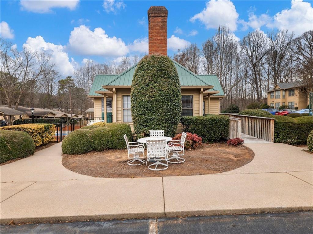 2235 Old Hamilton Place, Unit 100B Gainesville, GA 30507 - Photo 6 of 31 a view of a house with backyard and sitting area