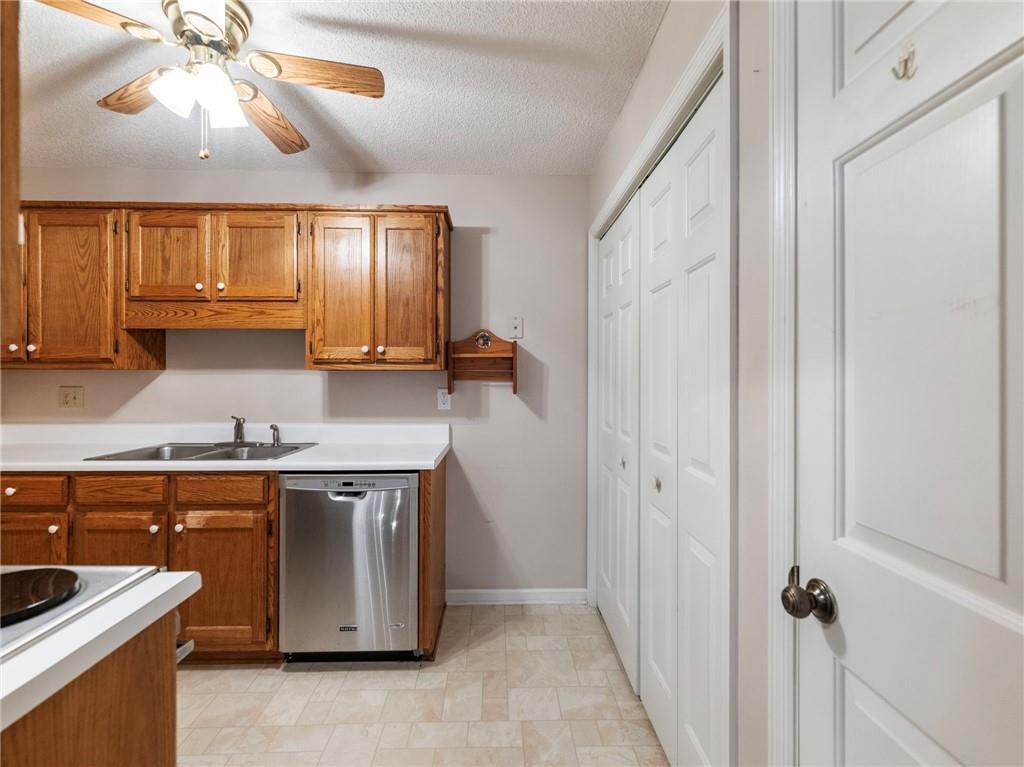 2235 Old Hamilton Place, Unit 100B Gainesville, GA 30507 - Photo 10 of 31 a kitchen with a sink stove and cabinets