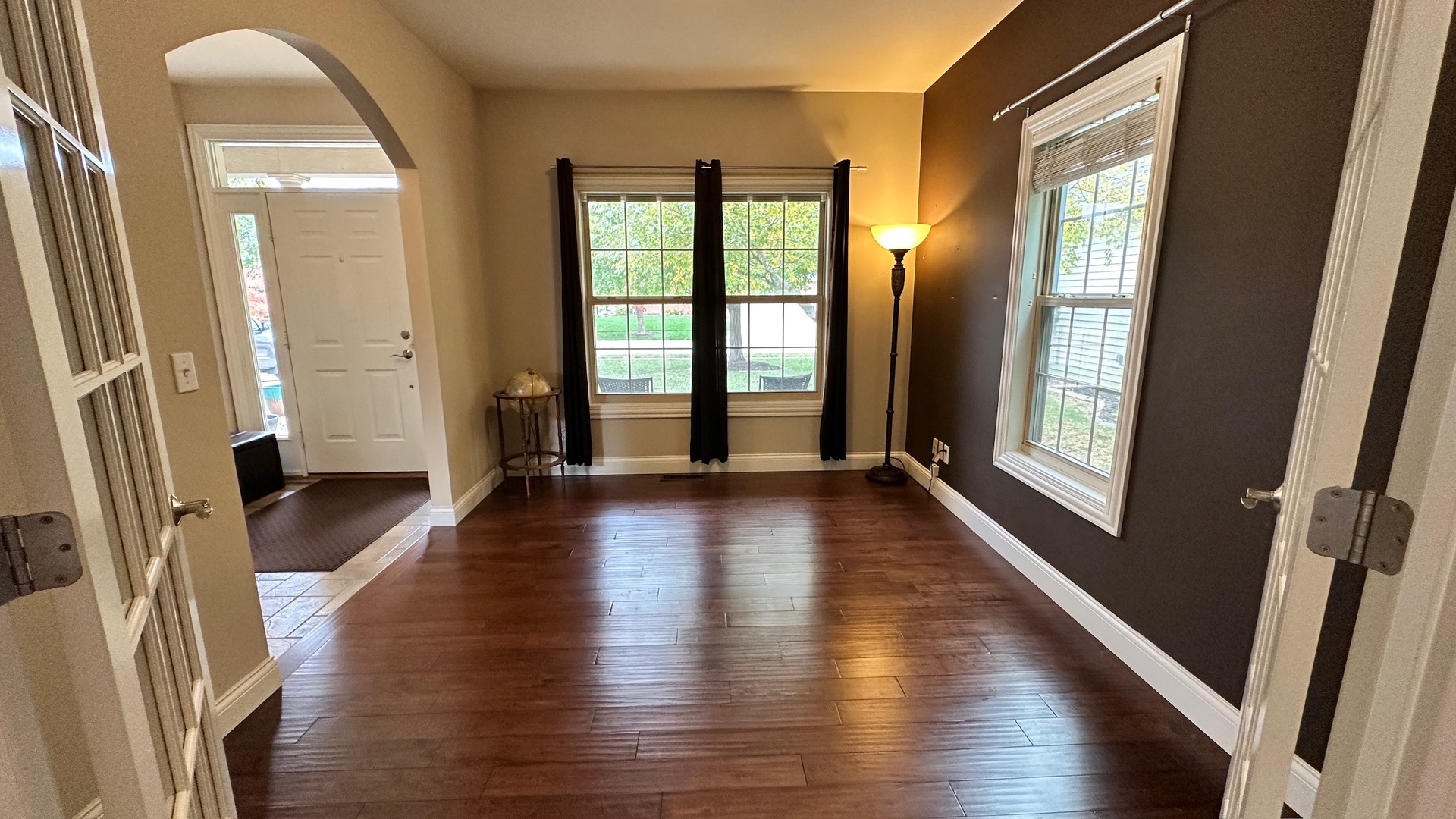 2906 Springhill Lane Champaign, IL 61822 - Photo 15 of 48 a view of a hallway with wooden floor and stairs