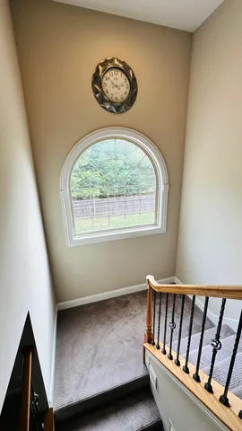 a spacious bathroom with a double vanity sink and a mirror