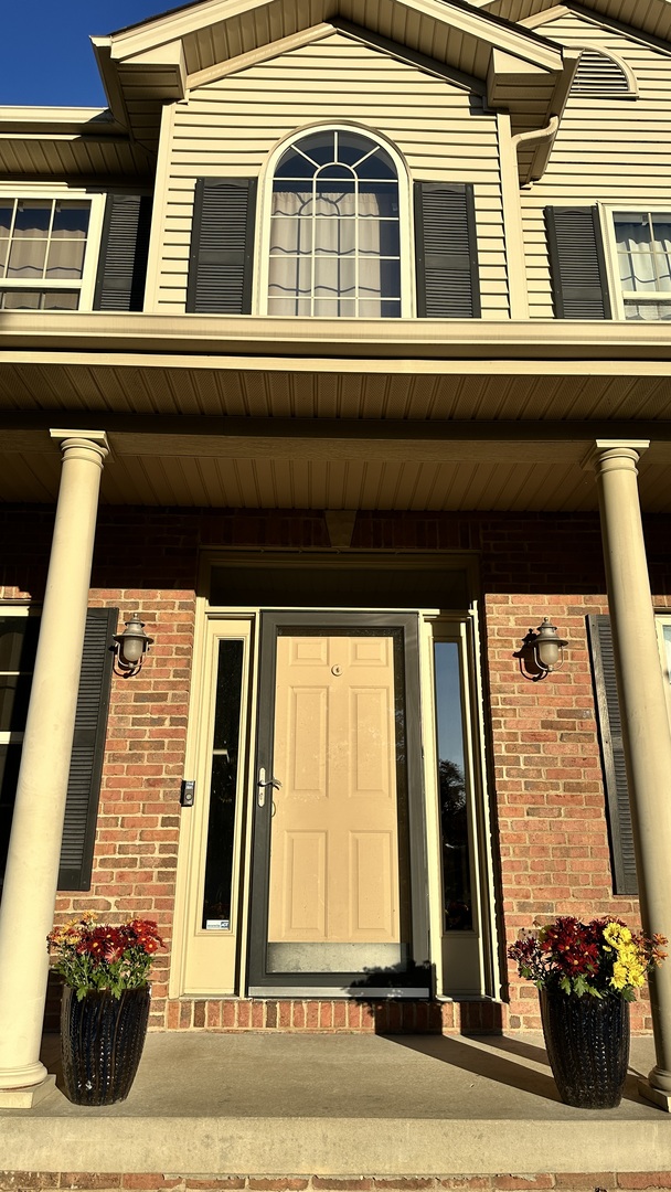 2906 Springhill Lane Champaign, IL 61822 - Photo 3 of 48 a view of a brick house with many windows