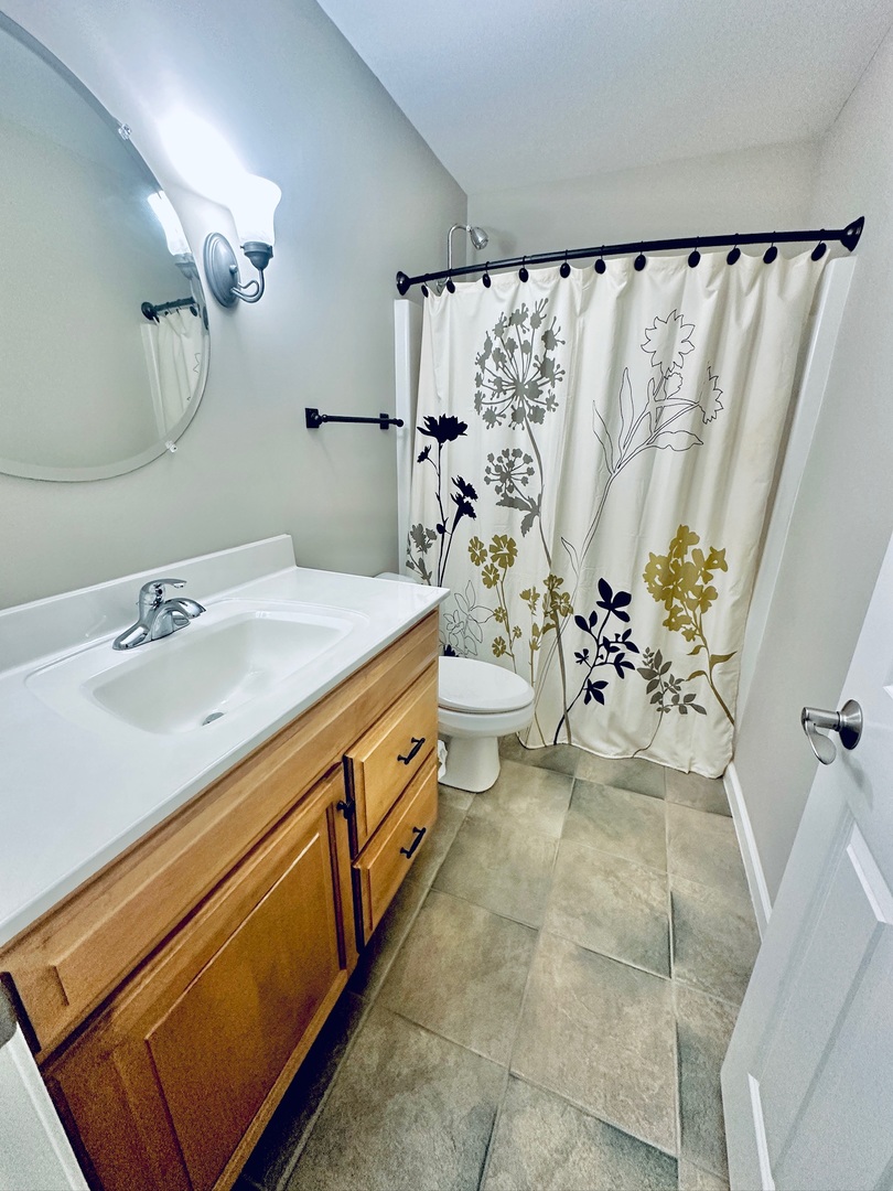 2906 Springhill Lane Champaign, IL 61822 - Photo 31 of 48 a spacious bathroom with a double vanity sink and a mirror