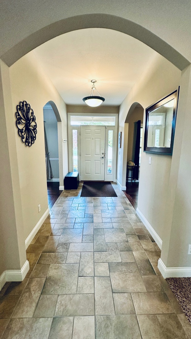 2906 Springhill Lane Champaign, IL 61822 - Photo 4 of 48 a view of a hallway with entryway windows and couch