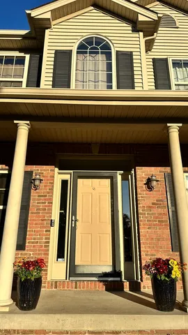 a kitchen with stainless steel appliances granite countertop a refrigerator a stove a sink and a microwave