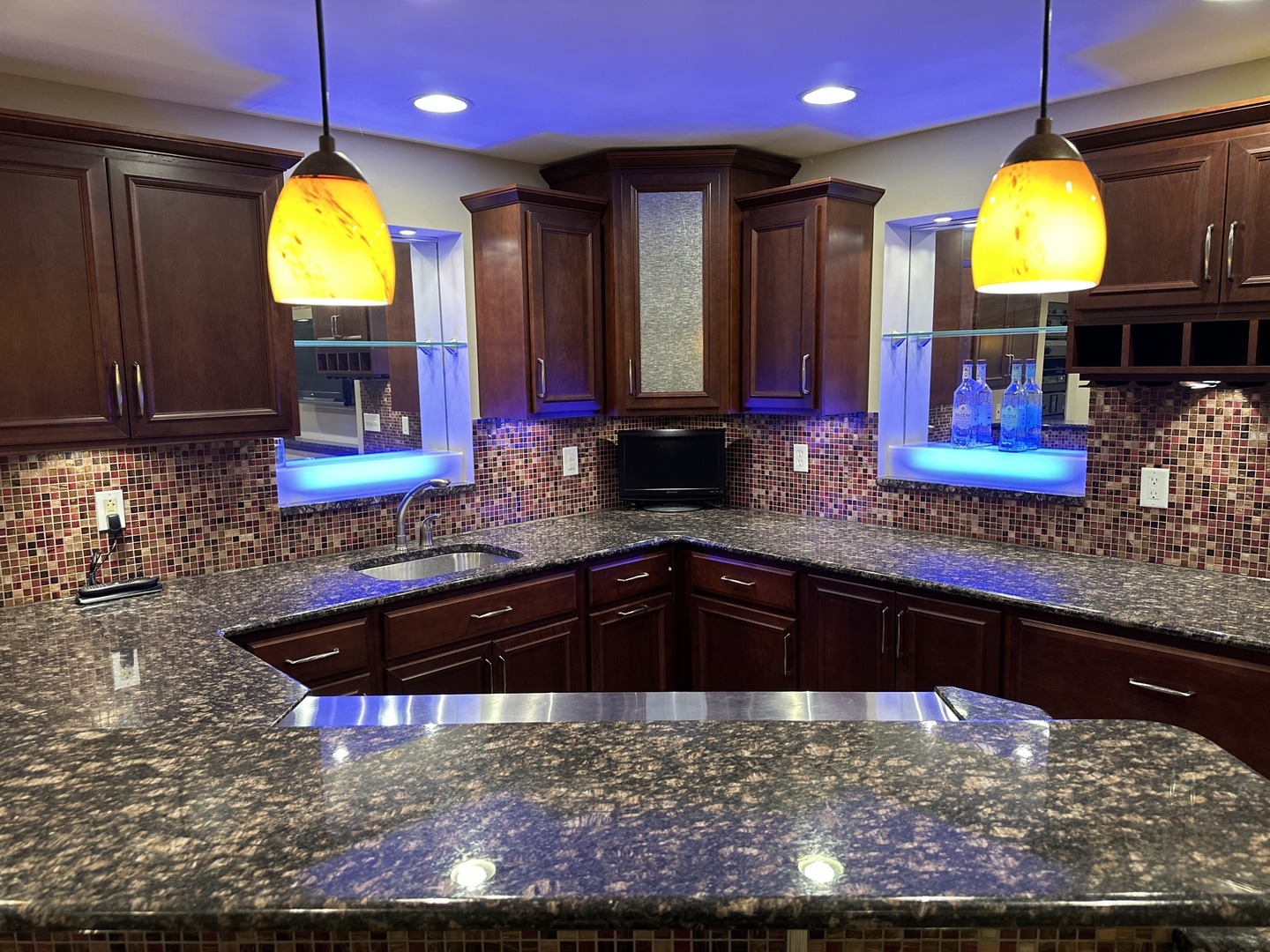 2906 Springhill Lane Champaign, IL 61822 - Photo 7 of 48 a view of a kitchen with kitchen island stainless steel appliances granite countertop a sink a stove and a wooden cabinets