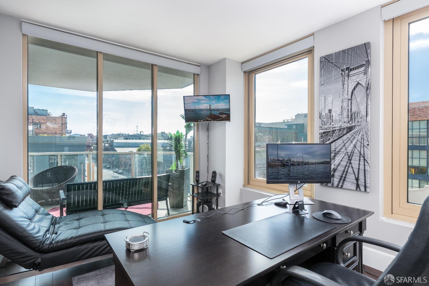 88 King Street, Unit 513 San Francisco, CA 94107 - Photo 11 of 41 a living room with furniture and a floor to ceiling window