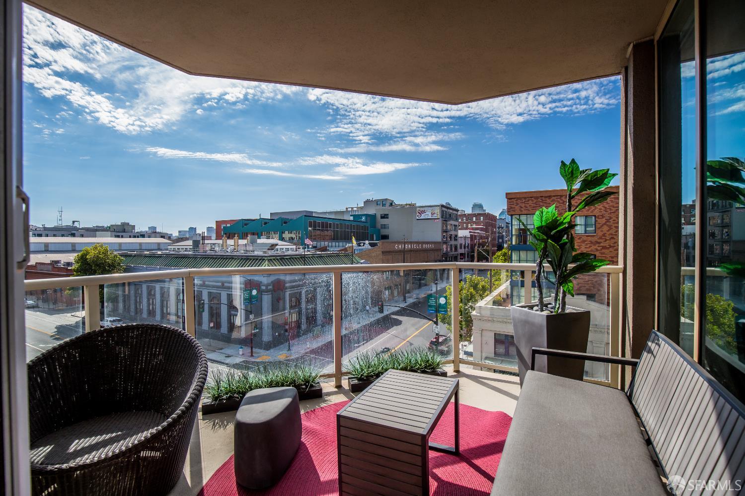 88 King Street, Unit 513 San Francisco, CA 94107 - Photo 13 of 41 a view of a balcony with chairs and a potted plant