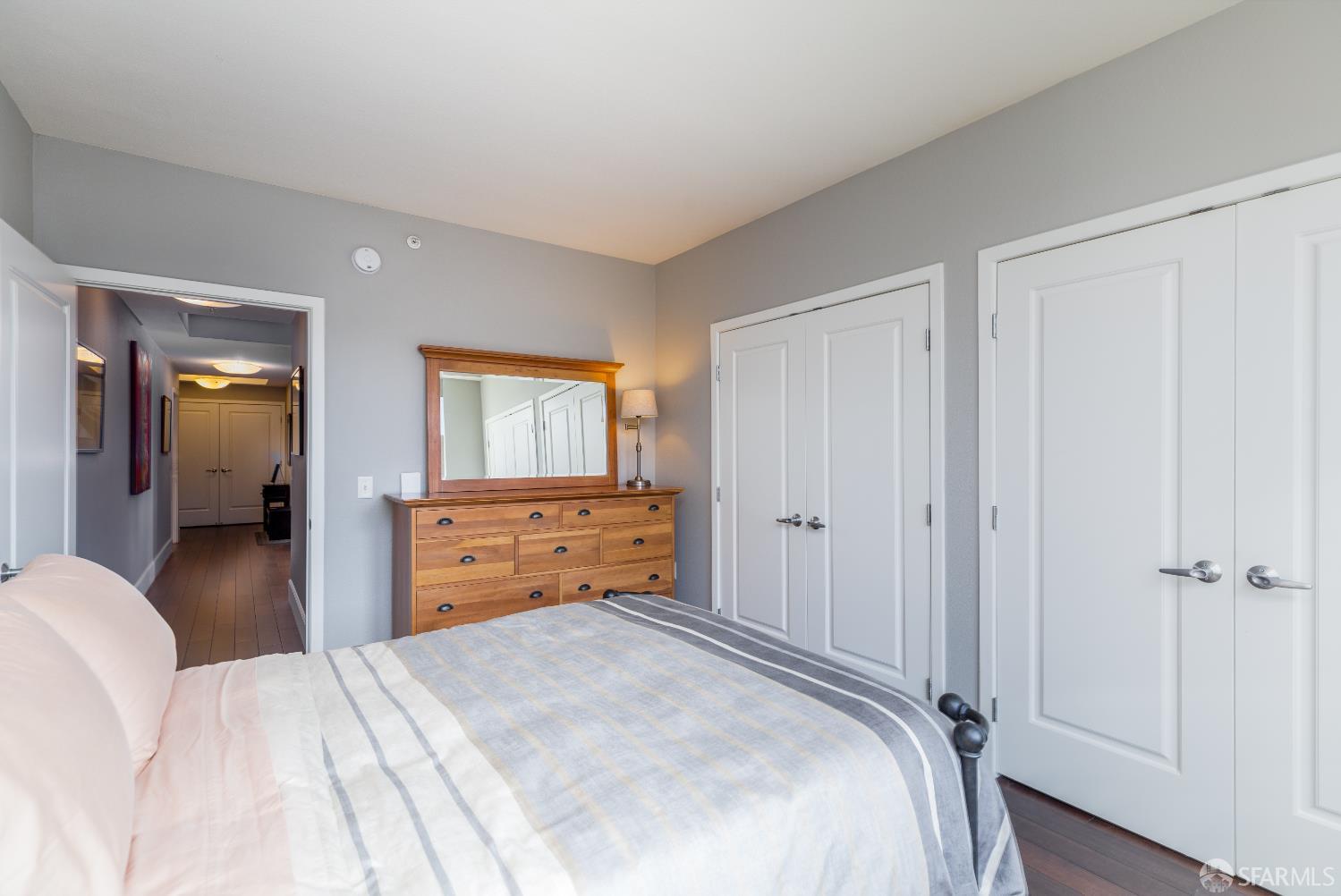 88 King Street, Unit 513 San Francisco, CA 94107 - Photo 16 of 41 a bedroom with a bed and a dresser