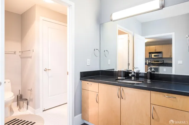 a bathroom with a toilet and shower