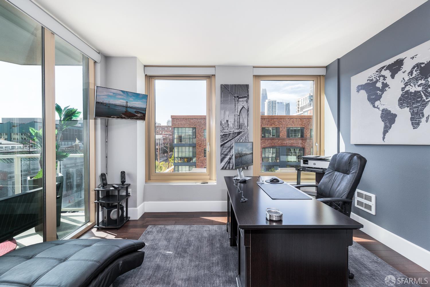 88 King Street, Unit 513 San Francisco, CA 94107 - Photo 10 of 41 a living room with furniture and large windows