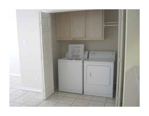 13969 Ports O Call Drive, Unit B Corpus Christi, TX 78418 - Photo 5 of 5 a utility room with dryer and washer