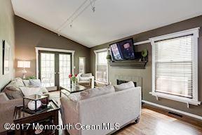 21 Maple Lane, Unit B Brielle, NJ 08730 - Photo 13 of 51 a living room with furniture and a large window