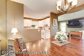 21 Maple Lane, Unit B Brielle, NJ 08730 - Photo 16 of 51 a dining room with furniture and wooden floor