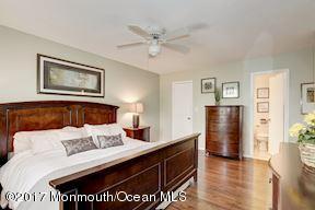21 Maple Lane, Unit B Brielle, NJ 08730 - Photo 24 of 51 a view of bedroom with furniture and wooden floor