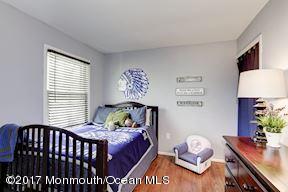 21 Maple Lane, Unit B Brielle, NJ 08730 - Photo 27 of 51 a bed room with a bed and a window