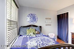 21 Maple Lane, Unit B Brielle, NJ 08730 - Photo 29 of 51 a living room with a couch