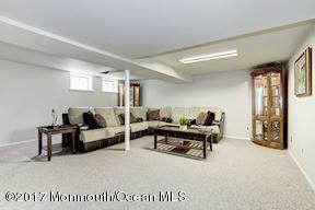 21 Maple Lane, Unit B Brielle, NJ 08730 - Photo 31 of 51 a living room with furniture window and a table
