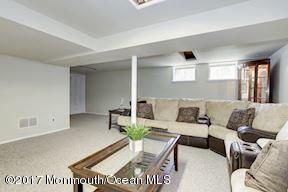 21 Maple Lane, Unit B Brielle, NJ 08730 - Photo 32 of 51 a living room with furniture and a window