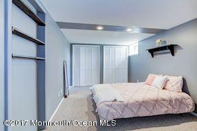 21 Maple Lane, Unit B Brielle, NJ 08730 - Photo 34 of 51 a bedroom with a bed and a window