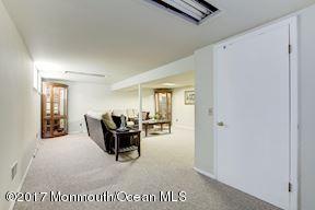 21 Maple Lane, Unit B Brielle, NJ 08730 - Photo 36 of 51 a living room with furniture