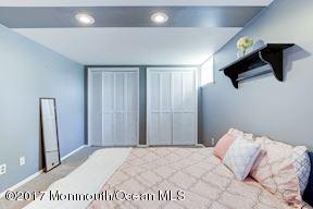 21 Maple Lane, Unit B Brielle, NJ 08730 - Photo 40 of 51 a bedroom with a bed and a flat tv screen
