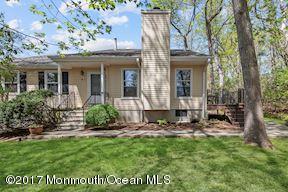21 Maple Lane, Unit B Brielle, NJ 08730 - Photo 4 of 51 a front view of a house with a garden