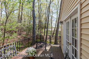 21 Maple Lane, Unit B Brielle, NJ 08730 - Photo 45 of 51 a view of a wooden door with a tree
