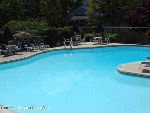 21 Maple Lane, Unit B Brielle, NJ 08730 - Photo 50 of 51 a view of swimming pool with outdoor seating and plants