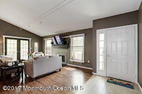 21 Maple Lane, Unit B Brielle, NJ 08730 - Photo 10 of 51 a living room with furniture and a fireplace