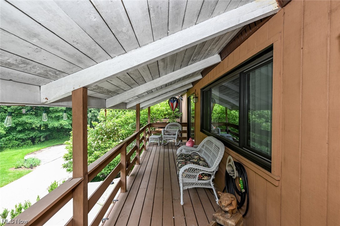 171 Granger Road, Unit 138 Medina, OH 44256 - Photo 16 of 31 Off the master bedroom this balcony offers a serene outdoor retreat with views of the lush landscape and wooded lot.