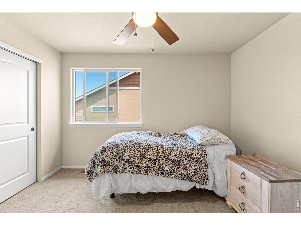 8847 16th St Road Greeley, CO 80634 - Photo 28 of 38 a bedroom with a bed and a window