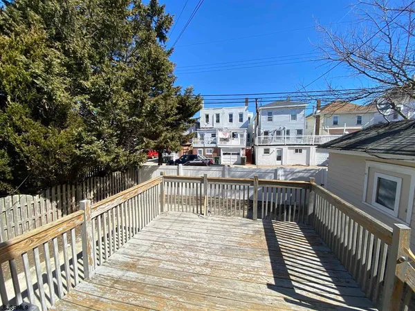 a view of a balcony with furniture