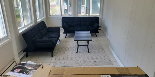 a living room with furniture and a rug