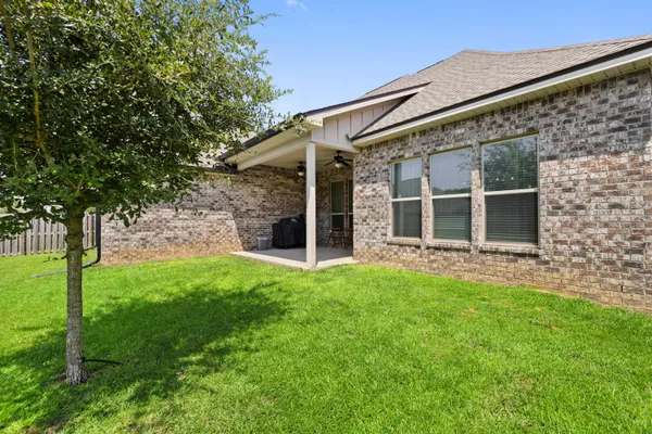 a view of a back yard of the house