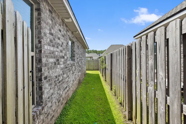 a view of a livingroom with furniture and a flat screen tv