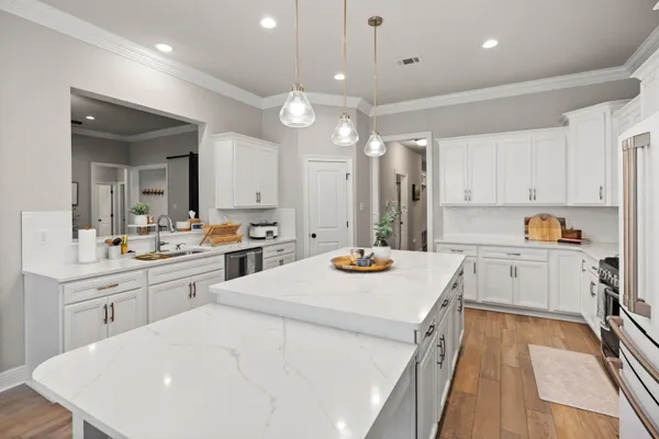 a bathroom with a tub a window and a shower