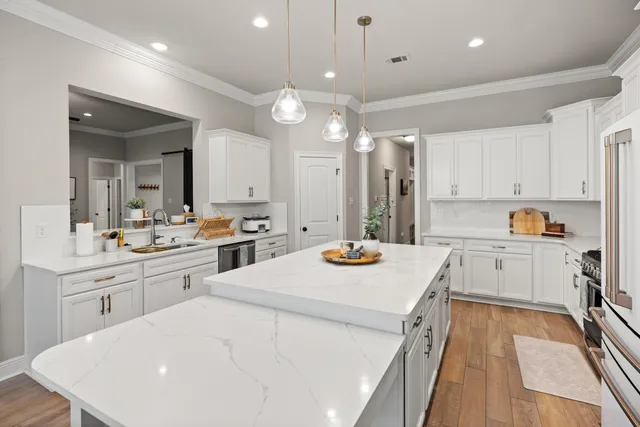 a bathroom with a tub a window and a shower