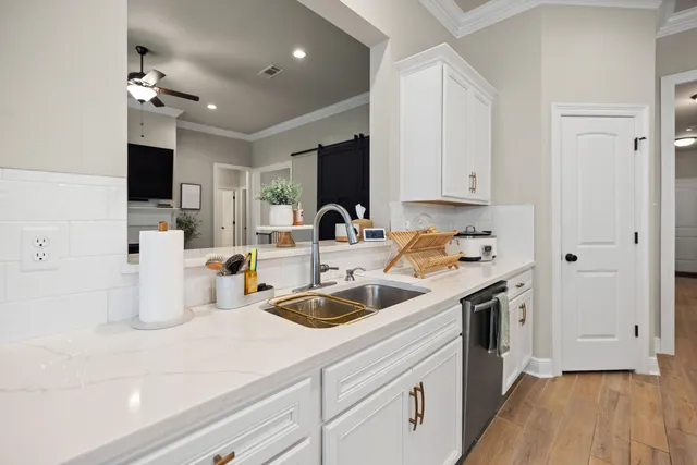 a view of walk in closet with clothes