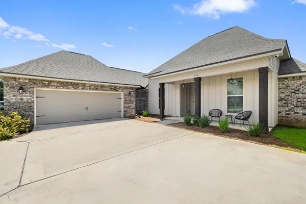a front view of house with garage