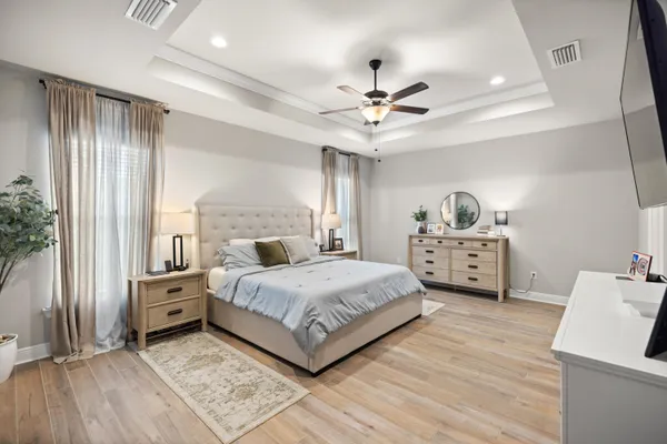 a bedroom with a bed and a book shelf