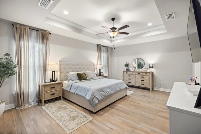 a bedroom with a bed and a book shelf