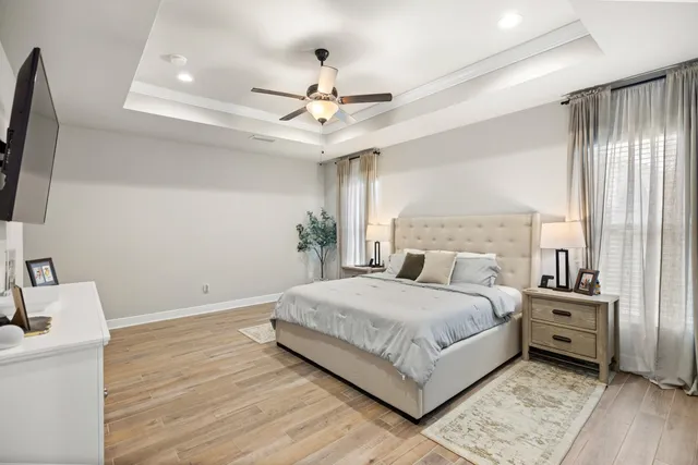 a bathroom with a sink vanity mirror bathtub shower and a toilet