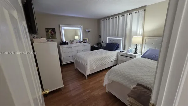 a bedroom with bed and a fireplace