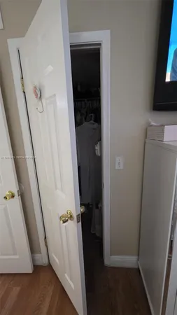 a kitchen with stainless steel appliances granite countertop a sink a stove a refrigerator a counter top space and cabinets