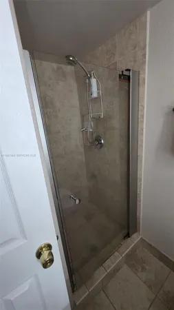 a kitchen with a large window and an outdoor view